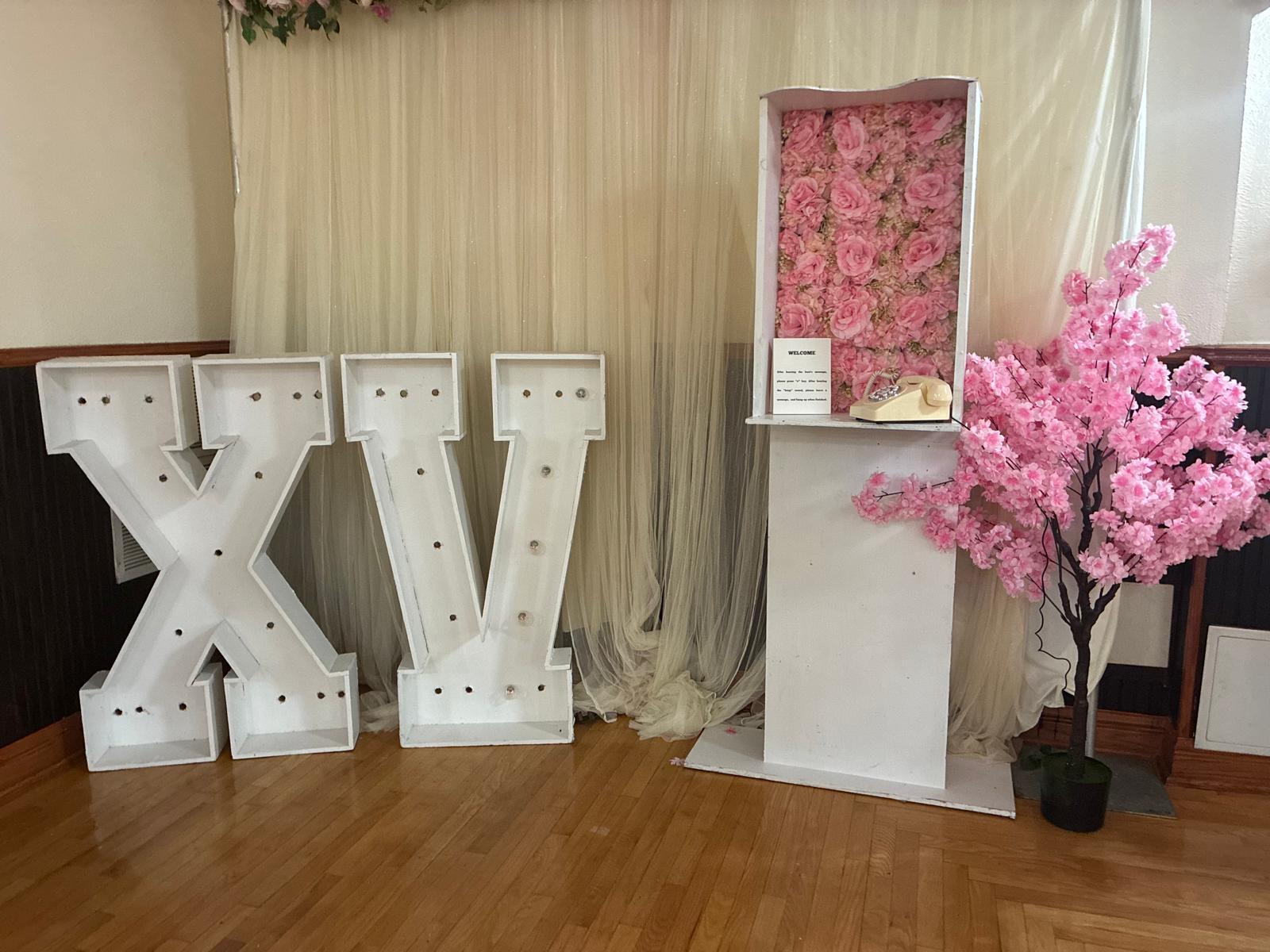 Decorated venue entrance with draped florals